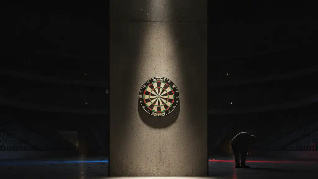 A lone dartboard under a spotlight in a dark arena, emergency lights reflecting.