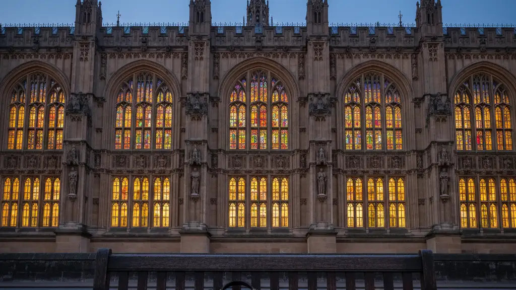 The House of Lords at dusk with a blurred briefcase in the foreground.