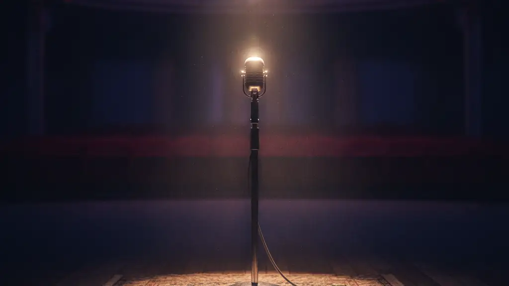 A lone microphone stand under a single spotlight on an empty, dark stage.