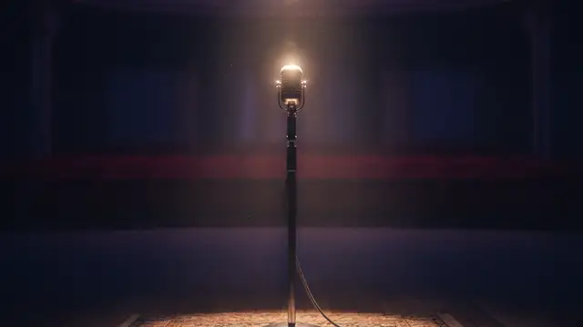 A lone microphone stand under a single spotlight on an empty, dark stage.