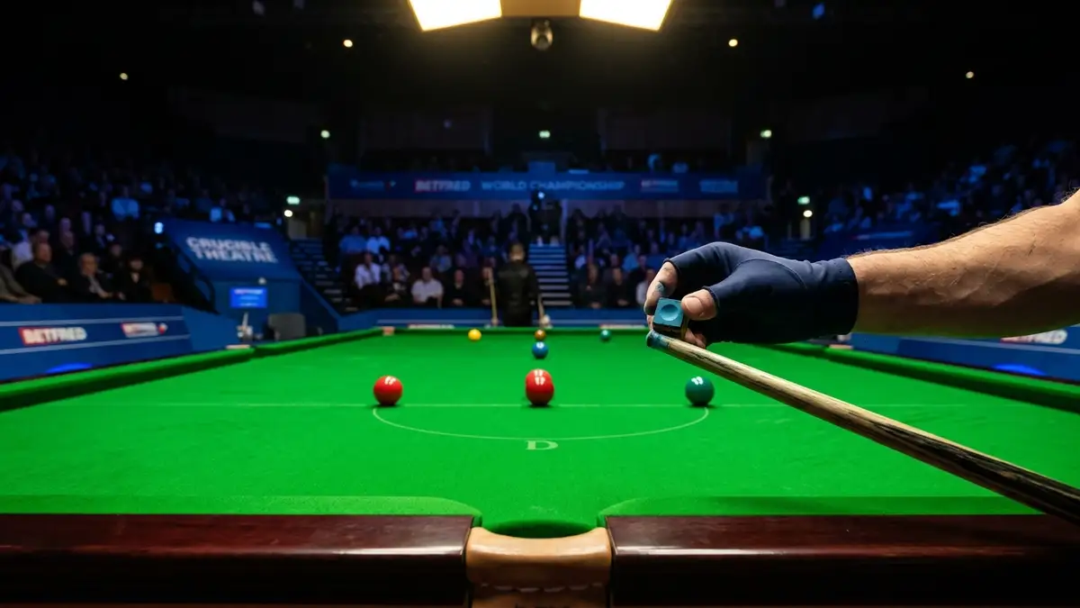 A gloved hand chalking a snooker cue on a pristine green snooker table under spotlights.